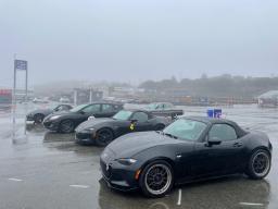 Rain-soaked black Mazdas ...
