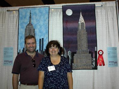 Steve with Kathy and the quilts at PIQF